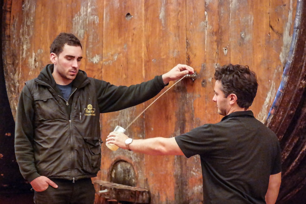 Basque Cider: Pouring some cider at Petritegi Sideria