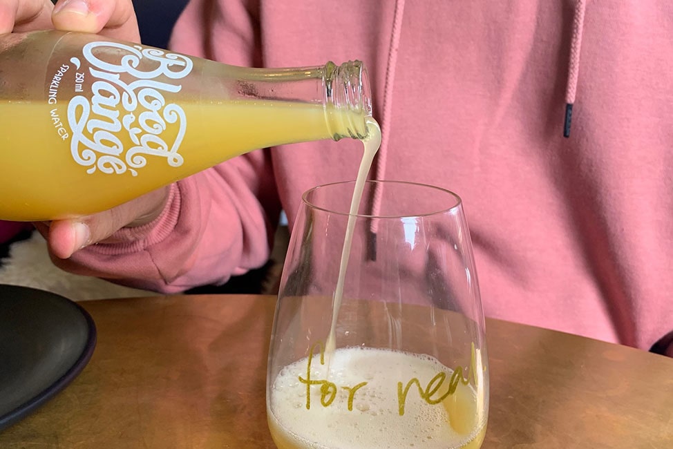 blood orange soda being poured